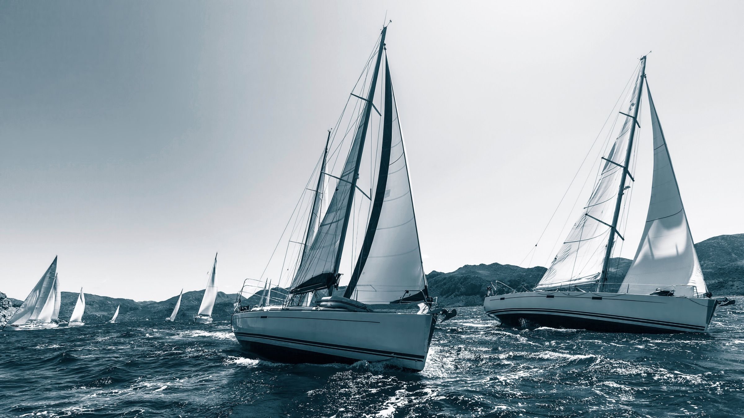Yachts sailing on open water